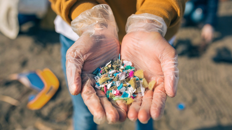 Hands holding plastic pieces